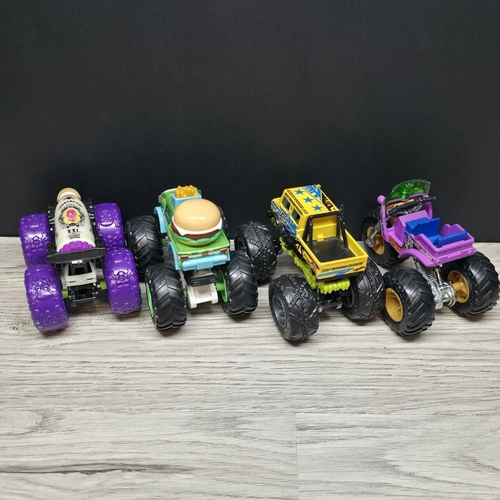 Hotwheels Monster Trucks Lot - Carbonator, Buns Of Steel, Unimog, And Tuk N Roll